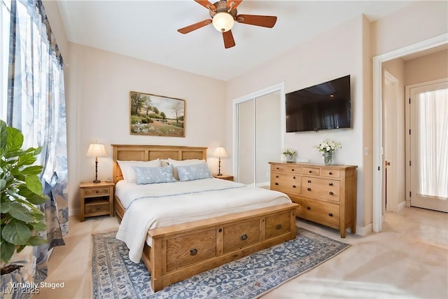 bedroom with baseboards, light carpet, and a ceiling fan