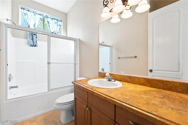 bathroom with vanity, toilet, bath / shower combo with glass door, tile patterned floors, and a chandelier