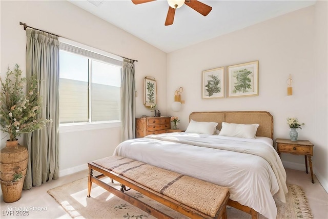 carpeted bedroom featuring a ceiling fan and baseboards