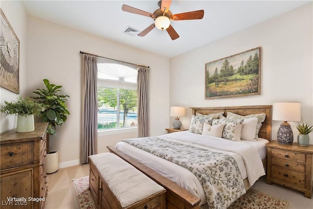 bedroom with baseboards, ceiling fan, and visible vents