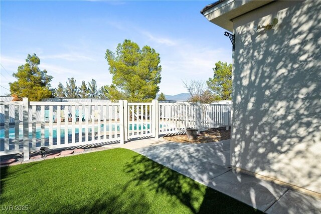 exterior space featuring fence and a community pool