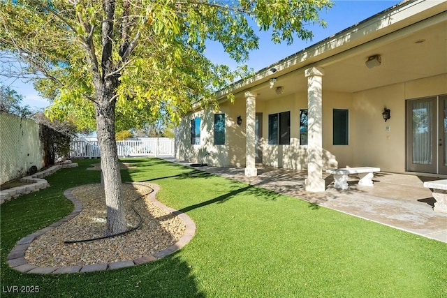 view of yard featuring a patio and a fenced backyard