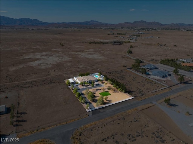 aerial view with a rural view, a mountain view, and a desert view