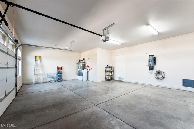 garage featuring baseboards and a garage door opener