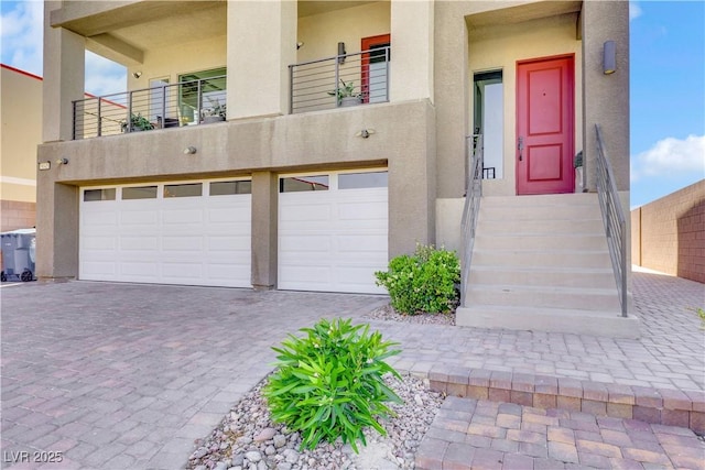 9045 Knots Estate St, Las Vegas, NV 89139 - exterior space with an attached garage, decorative driveway, and stucco siding