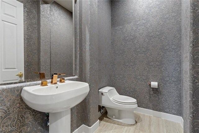 1911 Alcova Ridge Dr, Las Vegas, NV 89135 - bathroom with tile patterned floors, wallpapered walls, and toilet