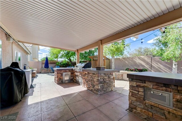 view of patio / terrace featuring a fenced backyard and area for grilling