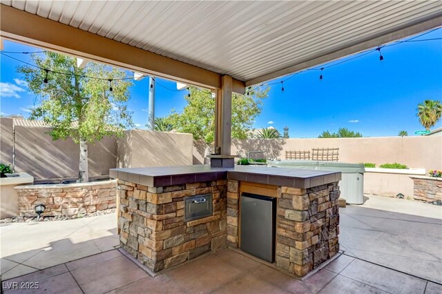 view of patio / terrace featuring a fenced backyard and area for grilling