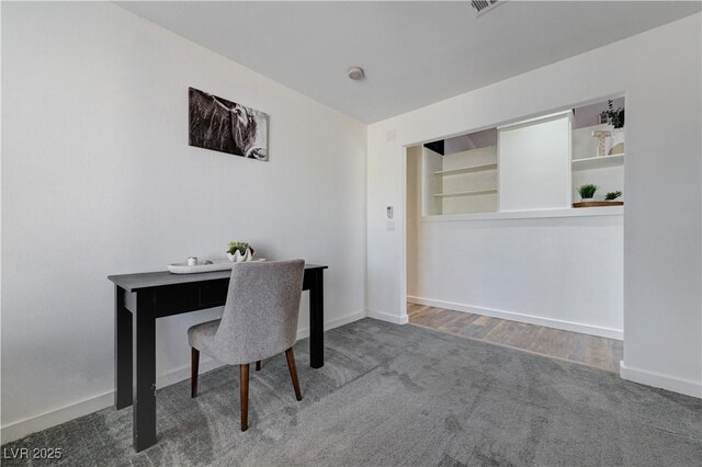 carpeted office with baseboards