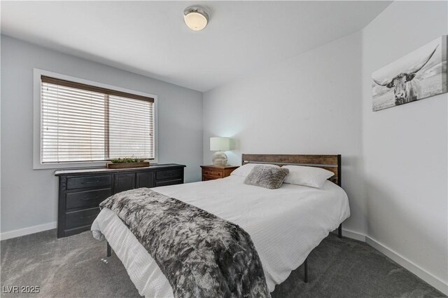 bedroom with carpet floors and baseboards