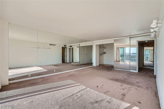3111 Bel Air Dr Unit 18B, Las Vegas, NV 89109 - spare room with carpet and visible vents