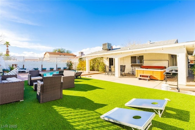 4471 Wisconsin Ave, Las Vegas, NV 89104 - rear view of property featuring a fenced backyard, a patio, a hot tub, and outdoor lounge area
