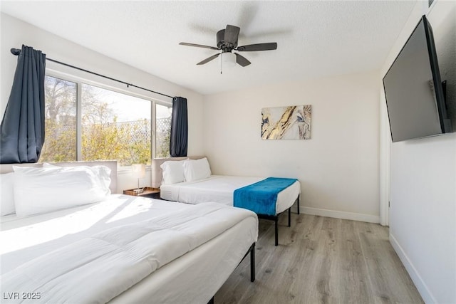 4471 Wisconsin Ave, Las Vegas, NV 89104 - bedroom featuring baseboards, a ceiling fan, and wood finished floors