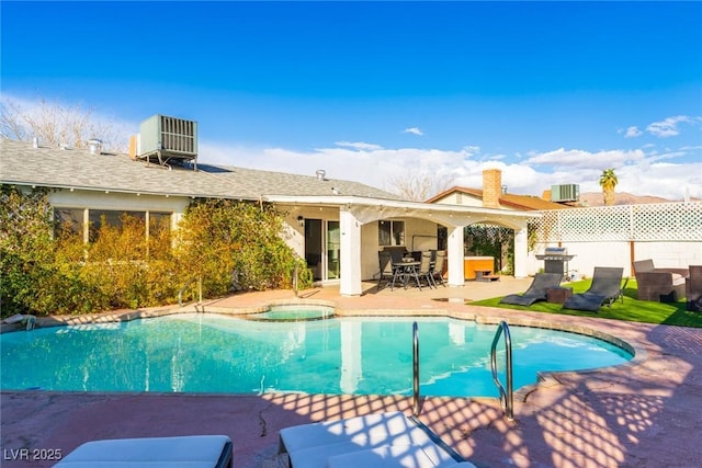 4471 Wisconsin Ave, Las Vegas, NV 89104 - view of pool featuring a patio area, fence, cooling unit, a fenced in pool, and a jacuzzi