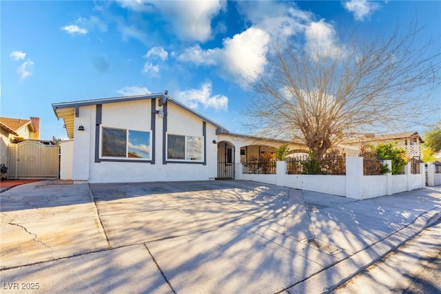 4471 Wisconsin Ave, Las Vegas, NV 89104 - ranch-style home featuring a gate, a fenced front yard, and stucco siding