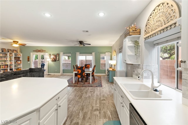 kitchen with a ceiling fan, recessed lighting, visible vents, a sink, and white cabinetry