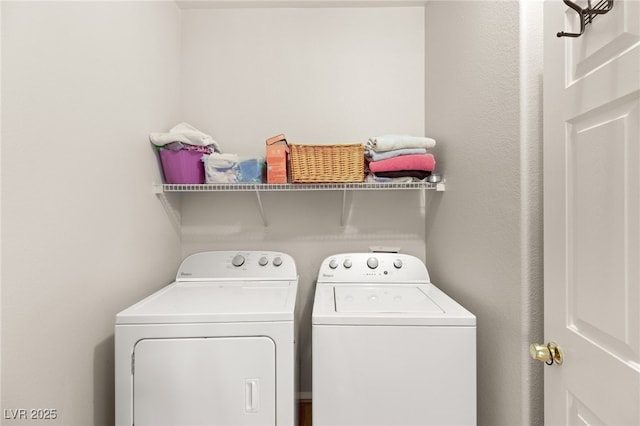 laundry room featuring washing machine and dryer and laundry area
