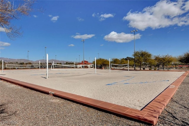view of community featuring a mountain view and volleyball court