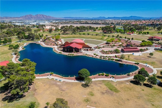 birds eye view of property with a water and mountain view