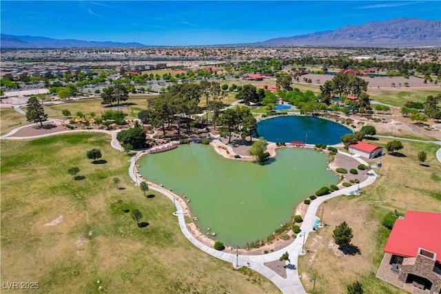 aerial view with a water and mountain view and a residential view