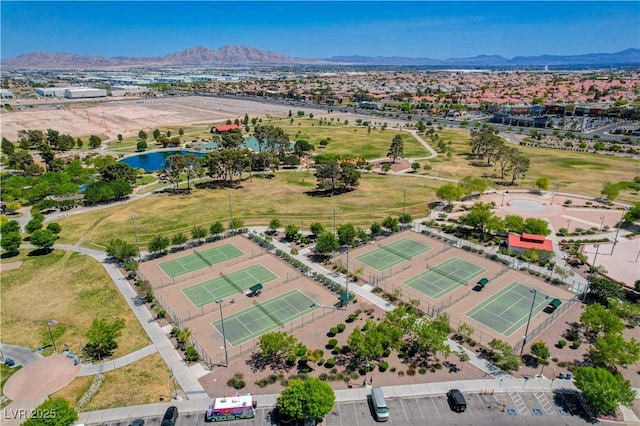 birds eye view of property featuring a water and mountain view