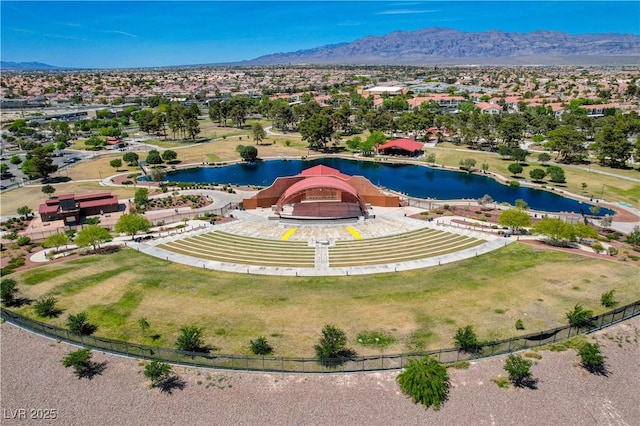 birds eye view of property featuring a water and mountain view