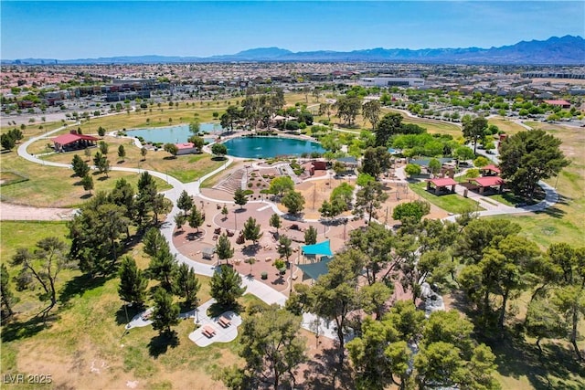 drone / aerial view featuring a water and mountain view