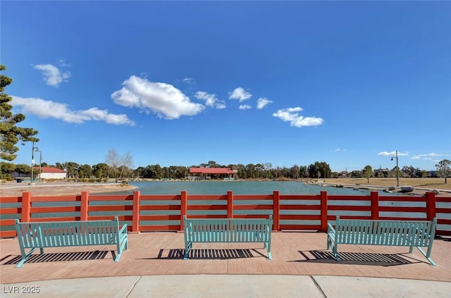 view of pool with a water view