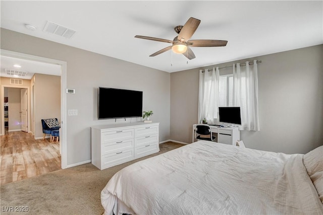 bedroom with carpet floors, baseboards, visible vents, and ceiling fan