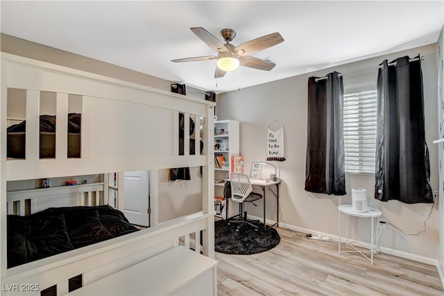 bedroom with baseboards, a ceiling fan, and wood finished floors
