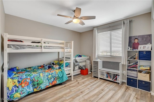 bedroom with ceiling fan and wood finished floors