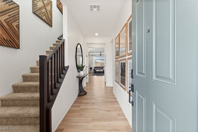 entryway featuring recessed lighting, visible vents, stairway, and light wood-type flooring