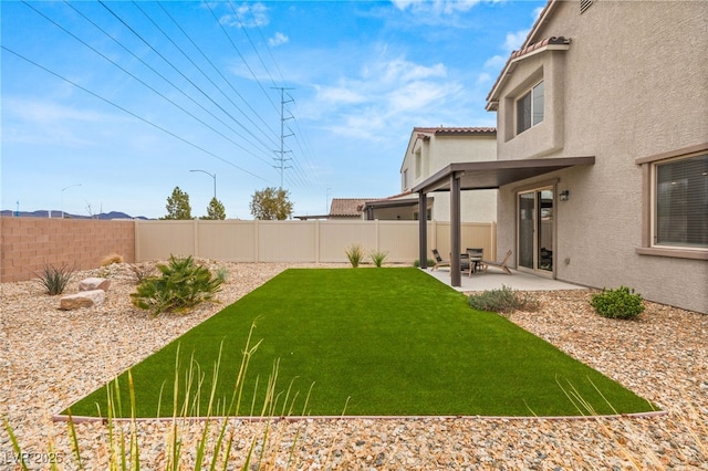 view of yard featuring a fenced backyard and a patio area