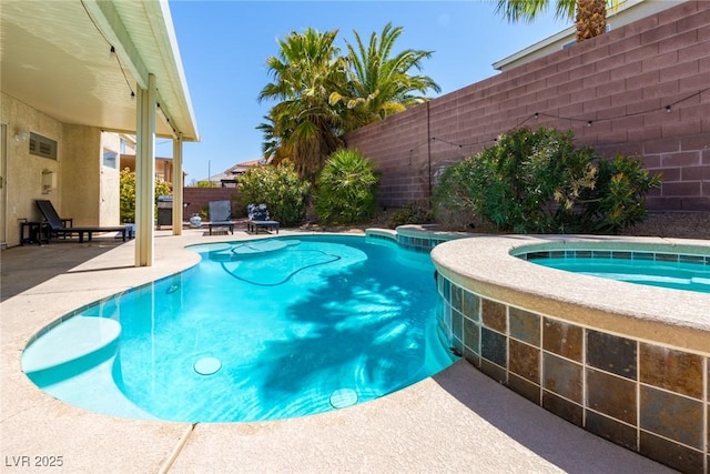view of pool featuring a fenced backyard, a fenced in pool, a patio, and an in ground hot tub