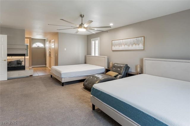 bedroom featuring recessed lighting, ceiling fan, and carpet
