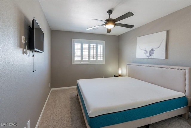 carpeted bedroom featuring baseboards, a ceiling fan, and visible vents