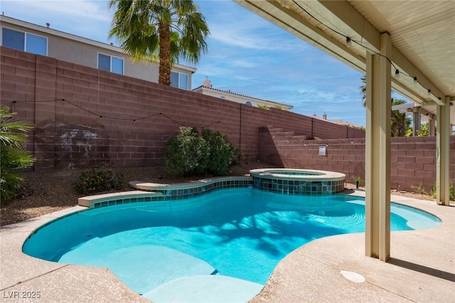 view of pool featuring a fenced backyard, a pool with connected hot tub, and cooling unit