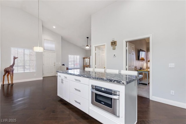 1084 Little House Ct, Henderson, NV 89011 - kitchen with baseboards, high vaulted ceiling, stainless steel oven, and ceiling fan