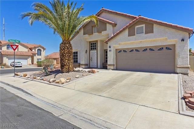 1084 Little House Ct, Henderson, NV 89011 - traditional-style home with a garage, stucco siding, driveway, and a tile roof