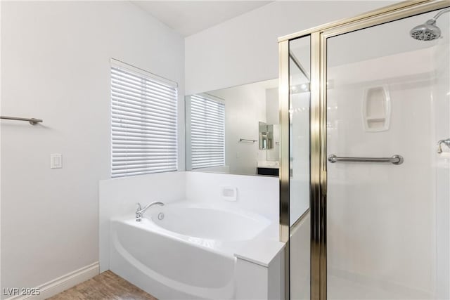 1084 Little House Ct, Henderson, NV 89011 - bathroom featuring baseboards, a garden tub, and a stall shower