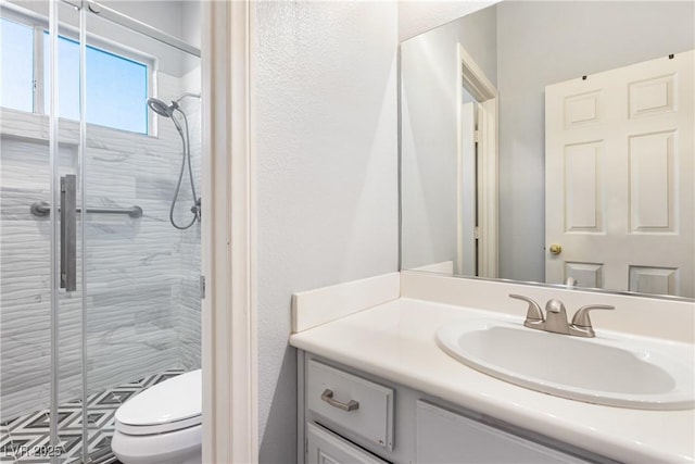 1084 Little House Ct, Henderson, NV 89011 - bathroom featuring vanity, a stall shower, and toilet
