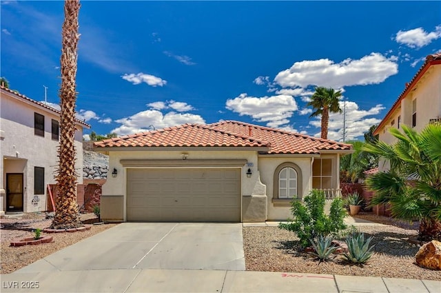 1012 Vanier Ct, Henderson, NV 89052 - mediterranean / spanish-style house with a garage, stucco siding, a tiled roof, and driveway