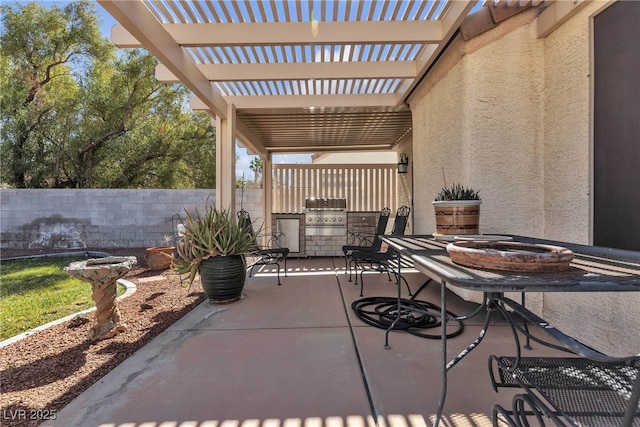 view of patio with an outdoor kitchen, fence, a pergola, and grilling area