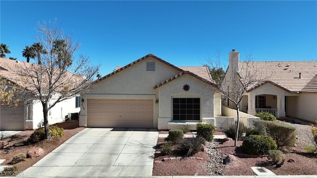 view of front of house with stucco siding, a chimney, central AC unit, concrete driveway, and an attached garage