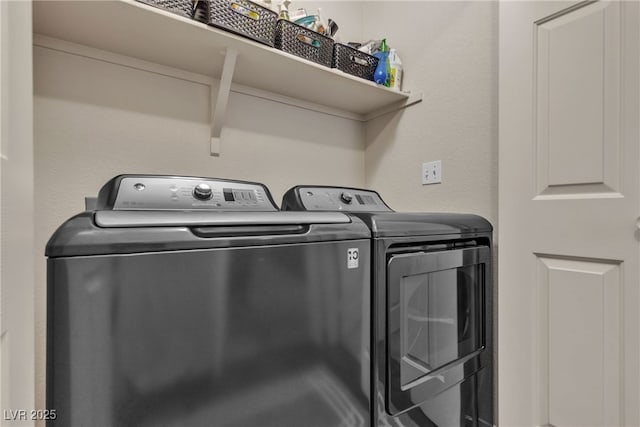 washroom with laundry area and independent washer and dryer