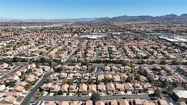 aerial view featuring a mountain view and a residential view
