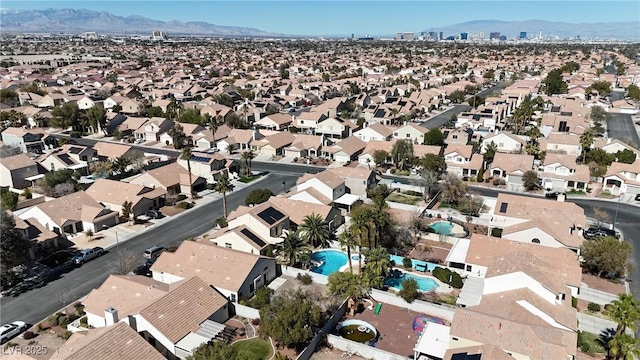birds eye view of property with a residential view and a mountain view