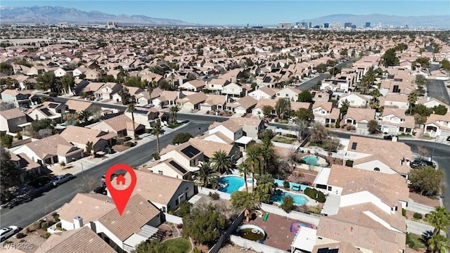 birds eye view of property featuring a mountain view