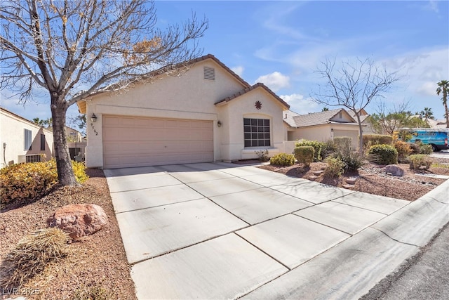 view of front of property with a tile roof, a garage, central air condition unit, concrete driveway, and stucco siding