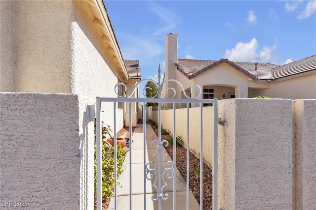 view of gate featuring fence
